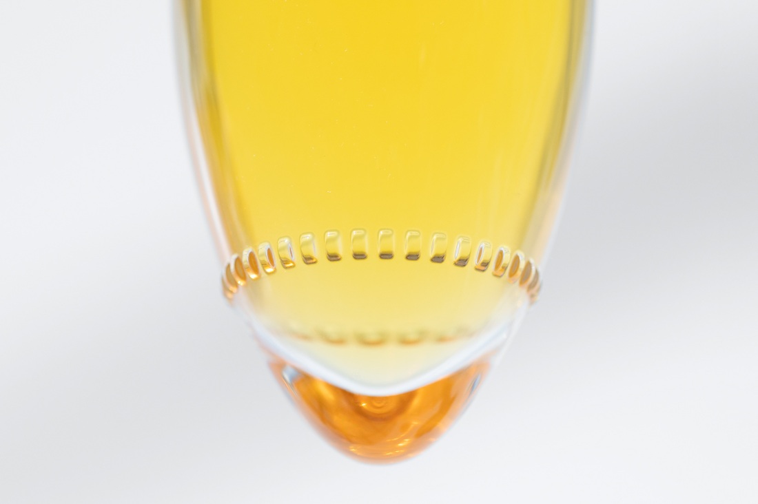 A close-up of the conical base of the bottle