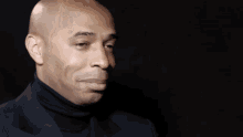 Thierry Henry stifling a laugh