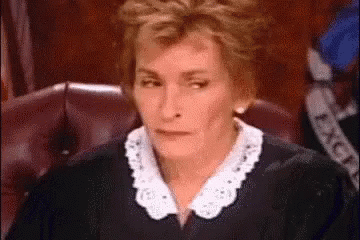 Judge Judy rolling her eyes and putting her head in her hand