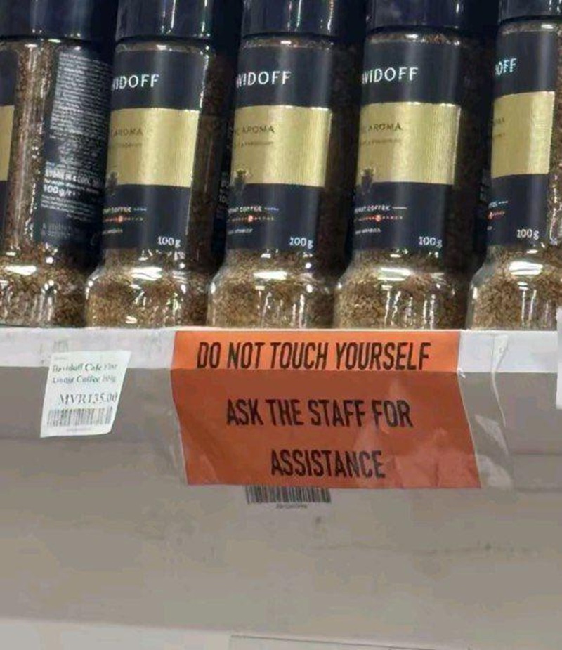 On shop shelf.

'Do not touch yourself. Ask the staff for assistance.