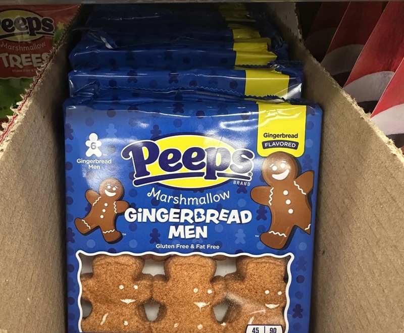 packet of gingerbread men that have had faces iced on in a weird position