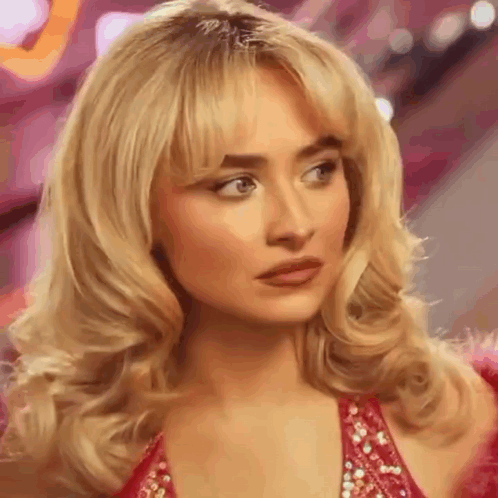 Sabrina Carpenter doing a look to camera.