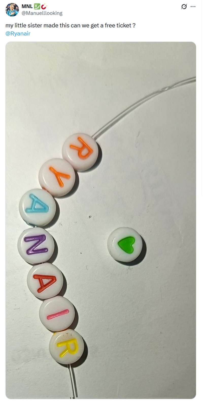 @Manuelllooking
my little sister made this can we get a free ticket ?

With a photo of a friendship bracelet made from plastic lettered beads, saying Ryanair