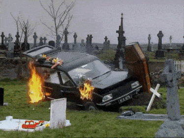 Father Dougal (from Father Ted) apologising to a singed funeral director as a crashed hearse burns in the background
