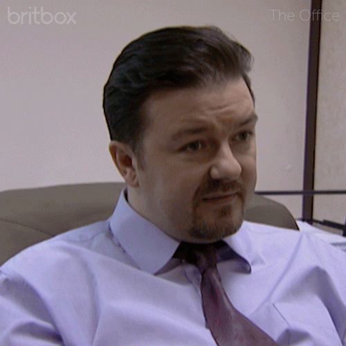 David Brent trying not to look at the camera.