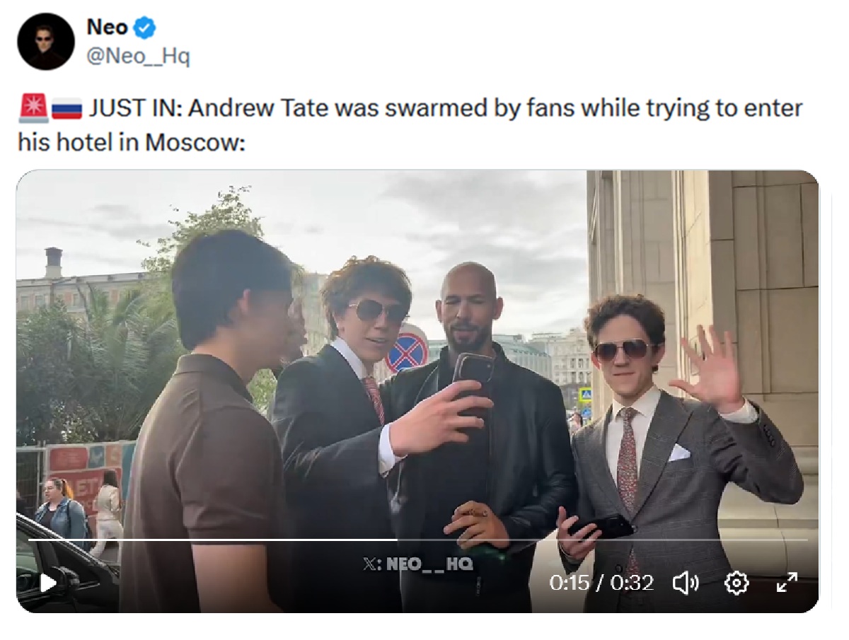 JUST IN: Andrew Tate was swarmed by fans while trying to enter his hotel in Moscow: (With screenshot of Tate and three male fans)