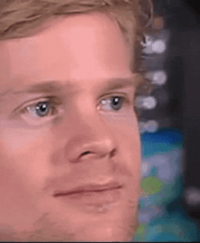 Man blinking rapidly in a surprised response to something