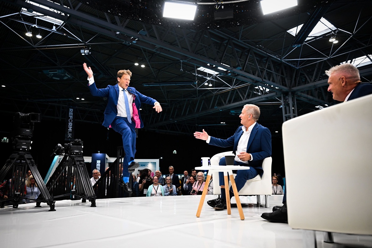 Richard Tice jumping enthusiastically on stage with Jeremy Kyle