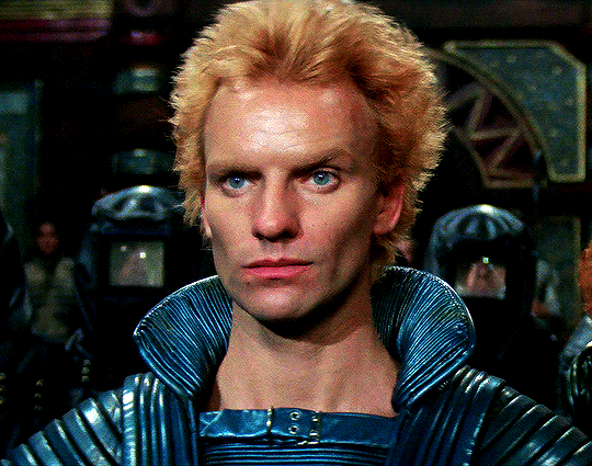 Sting in Dune, looking unamused and raising an eyebrow